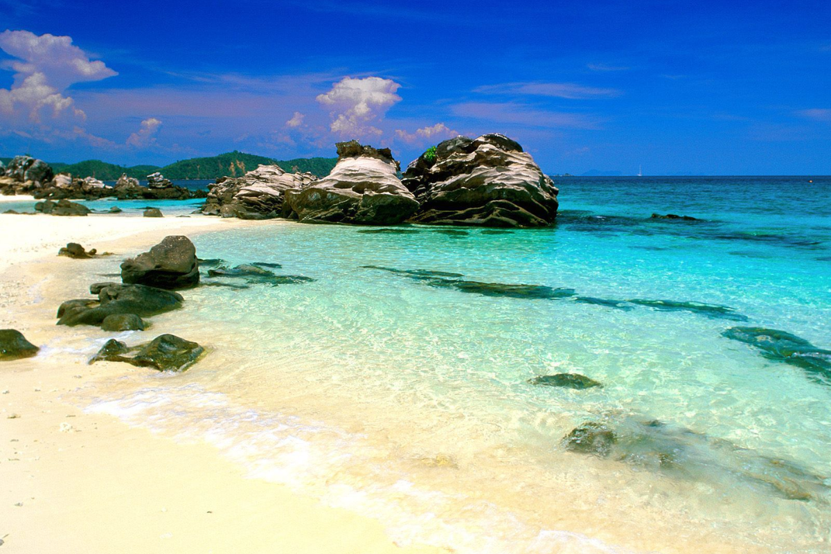 Phuket beach with turquoise waters and blue skies in December